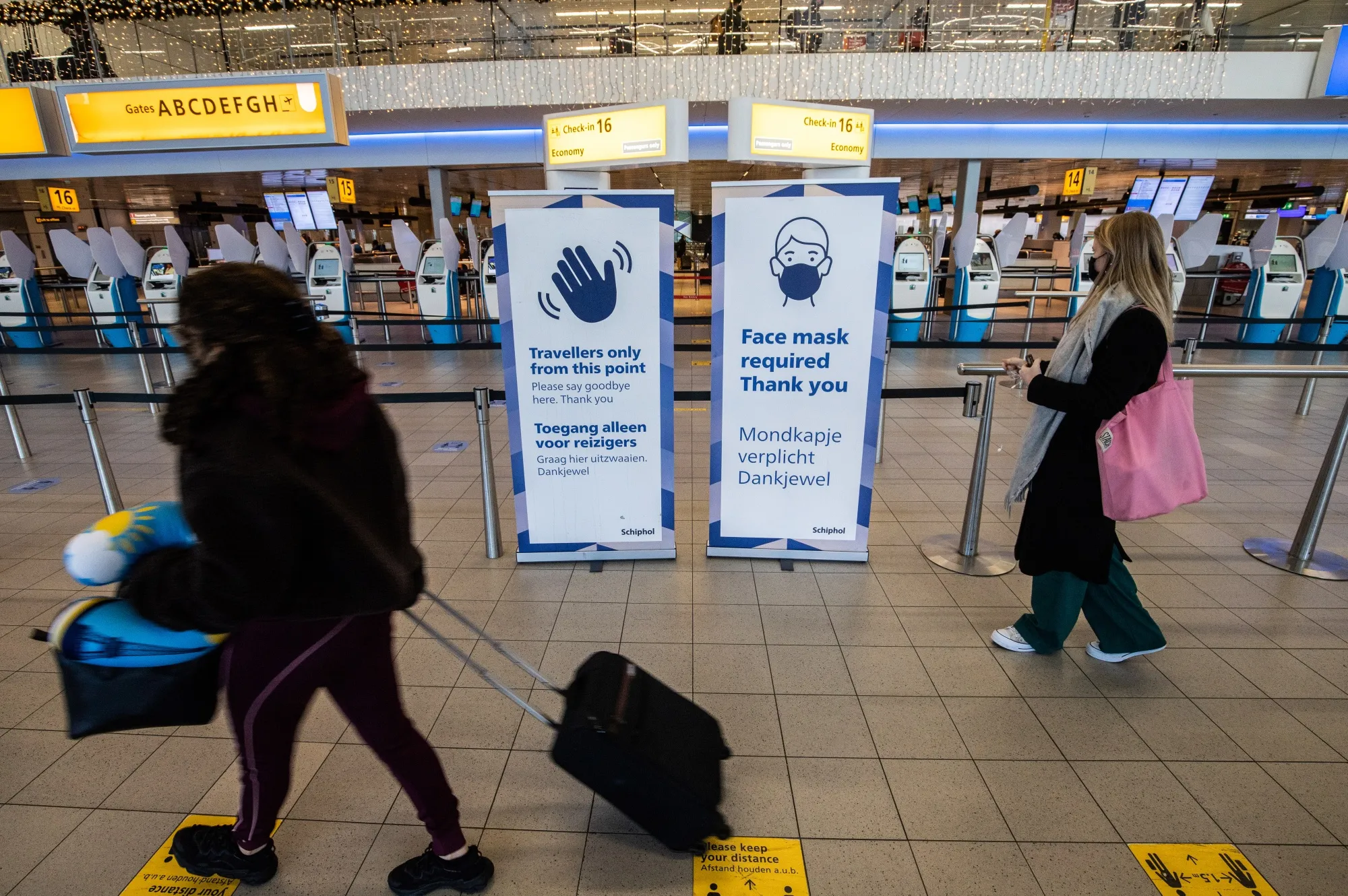 The departures hall at Schiphol Airport in Amsterdam. Concerns about the omicron&nbsp;variant are shutting down travel lanes that had started to open in recent weeks, threatening holiday travel around the world.
