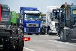 Newly-manufactured Volvo FH heavy goods trucks stand in the parking lot before shipping at the Volvo AB manufacturing plant.