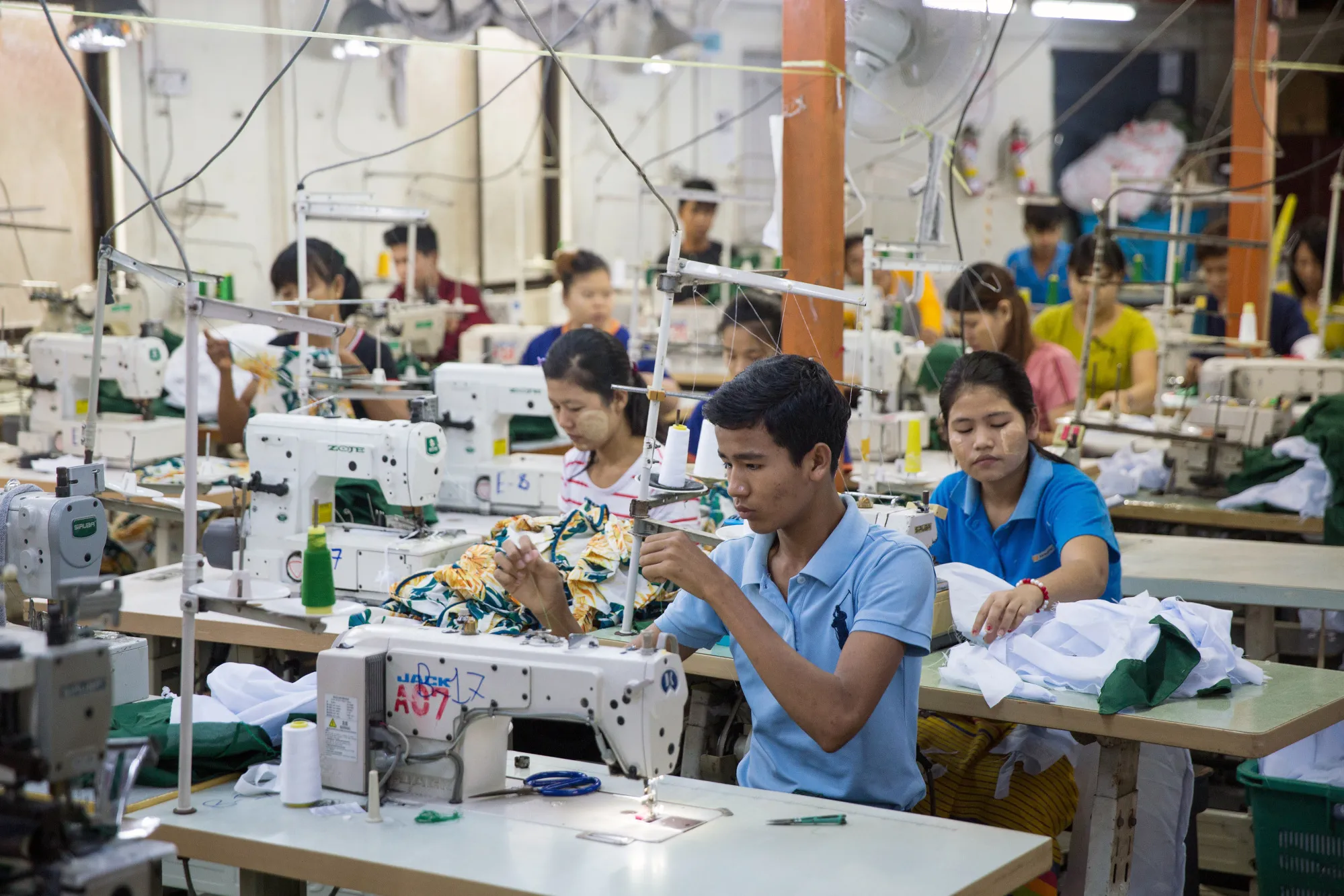 Workers use sewing machines to manufacture shirts&nbsp;in Yangon, Myanmar.