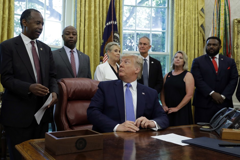 President Donald Trump, with HUD Secretary Ben Carson, signed an executive order focused on affordable housing regulations on June 25.