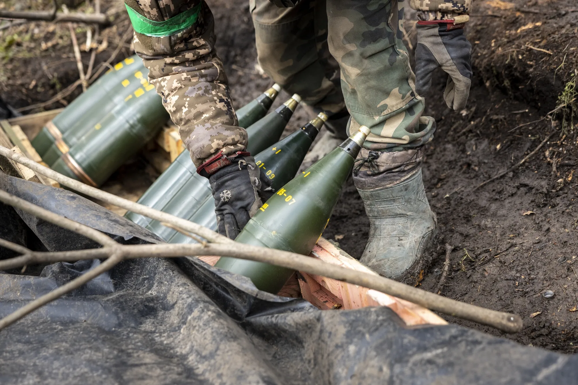 Ukrainian servicemen prepare artillery shells in Donetsk, Ukraine.