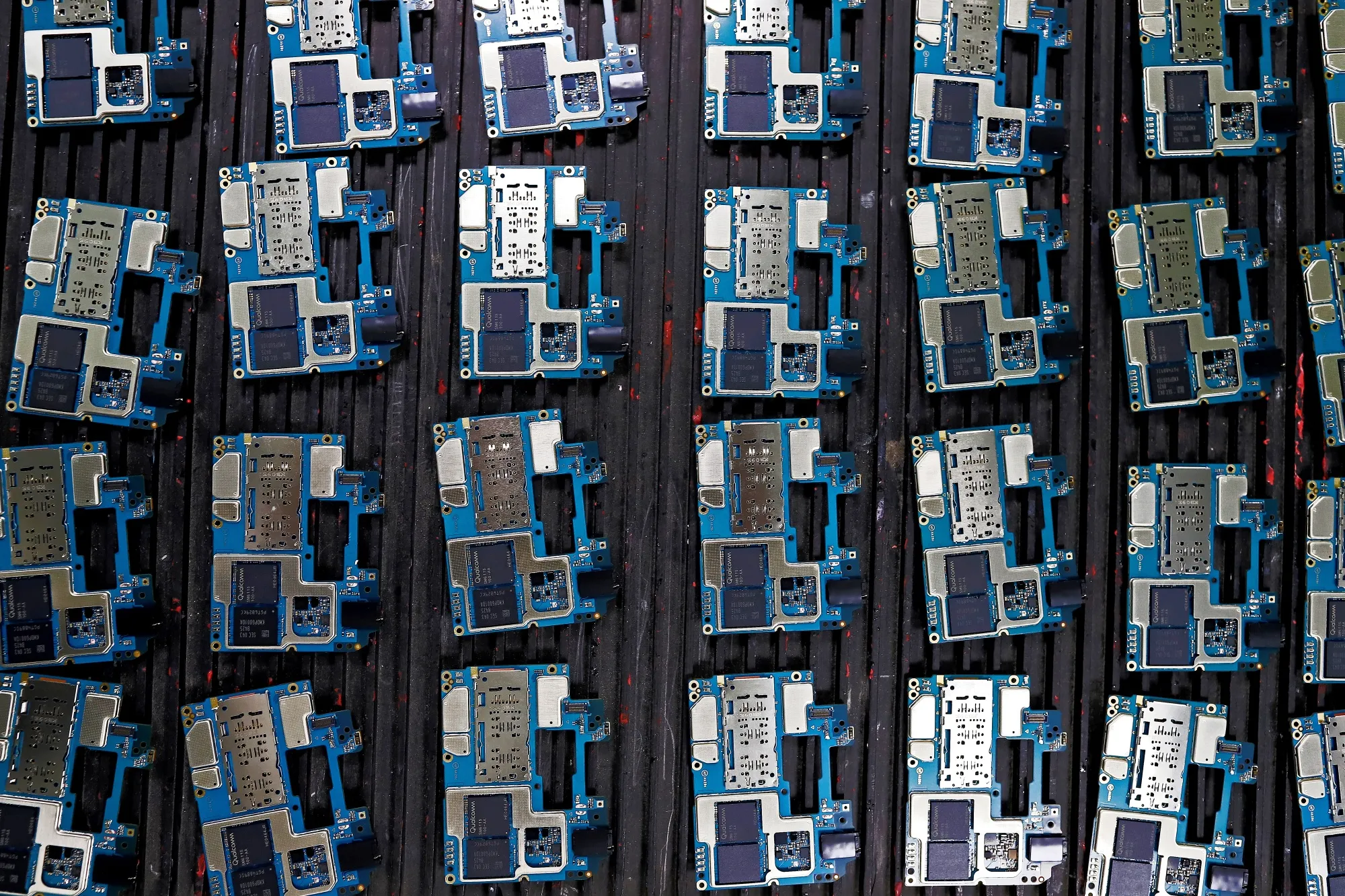 Circuit boards for smartphones on an assembly line in Noida, Uttar Pradesh, India.