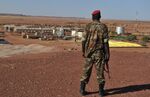 A Nigerien Soldier walks outside France's state-owned nuclear giant Areva's uranium mine in 2010 in Arlit.