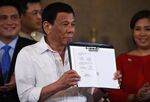 Rodrigo Duterte after signing the Identification System Act in Manila on Aug. 6.