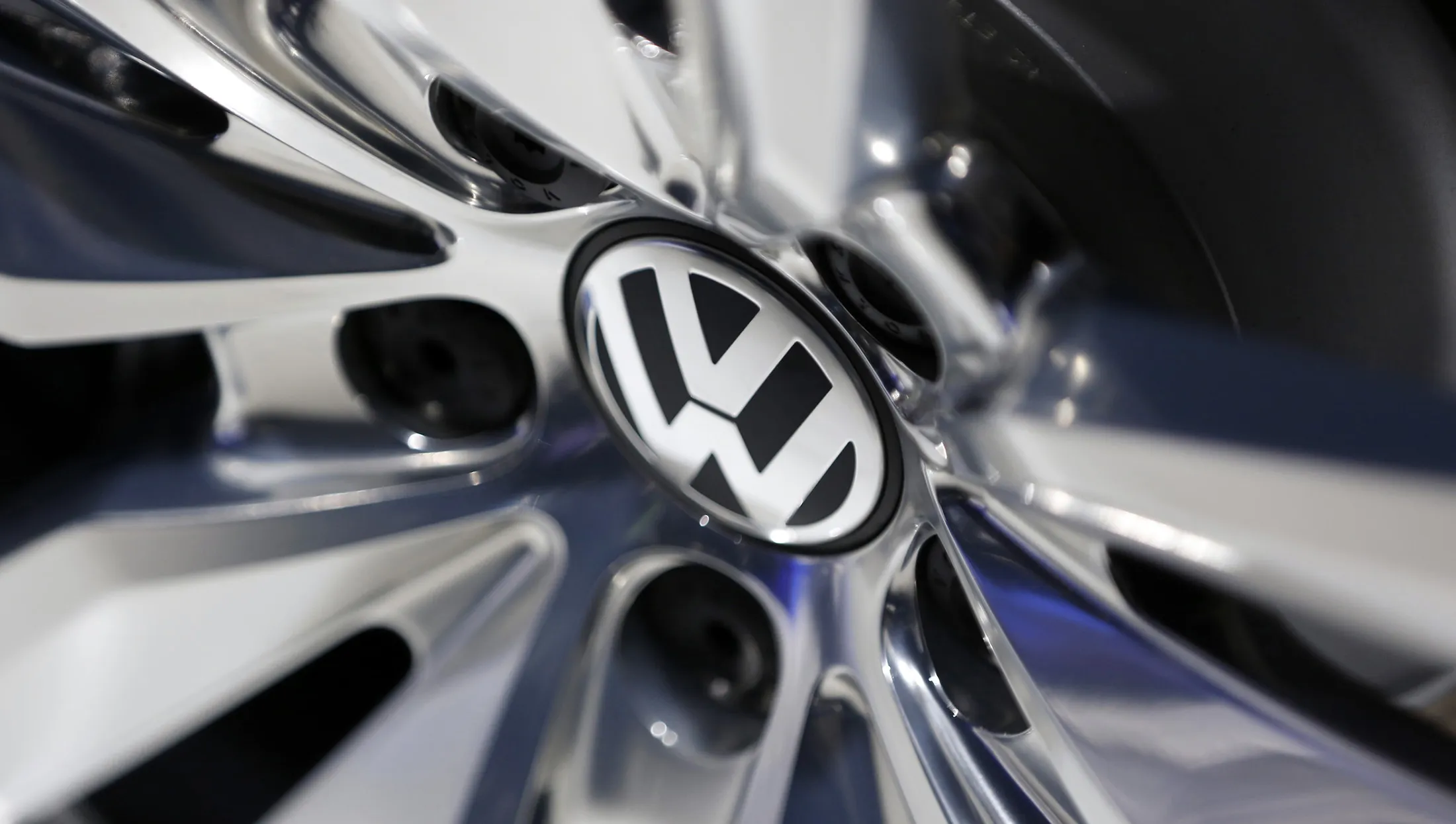 A VW logo sits on the alloy wheel of a Volkswagen automobile, produced by Volkswagen AG (VW), at the 65th Frankfurt International Motor Show in Frankfurt, Germany, on Tuesday, Sept. 10, 2013.
