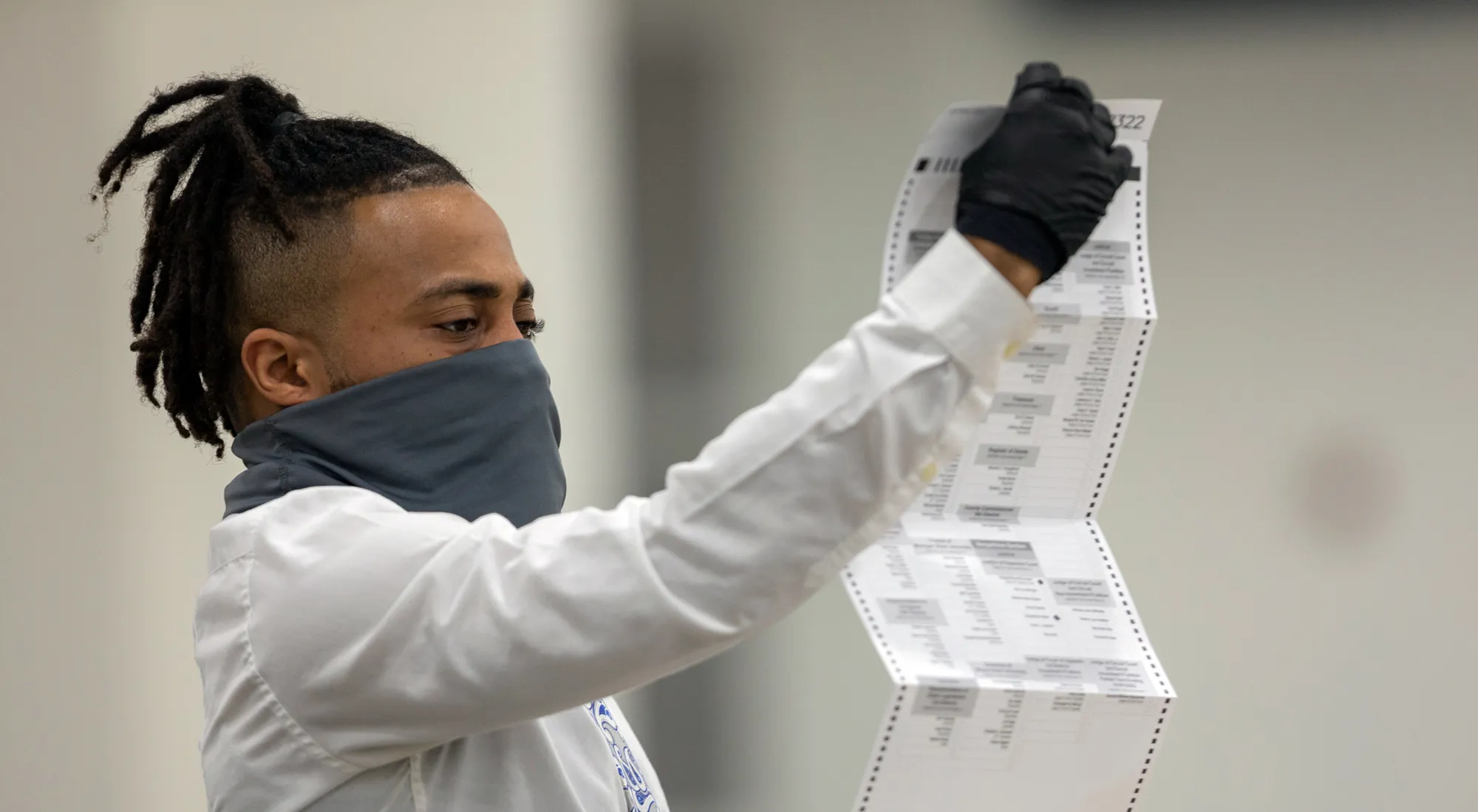 A worker with the Detroit Department of Elections inspects an absentee ballot&nbsp;in Detroit, Michigan, on Nov. 4.