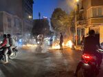 Fires on a street&nbsp;during protests in&nbsp;Tehran, on Oct. 8.