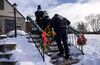 EMTs transport a woman with COVID-19 symptoms to a hospital in Yonkers, New York, on Dec. 17, 2020.