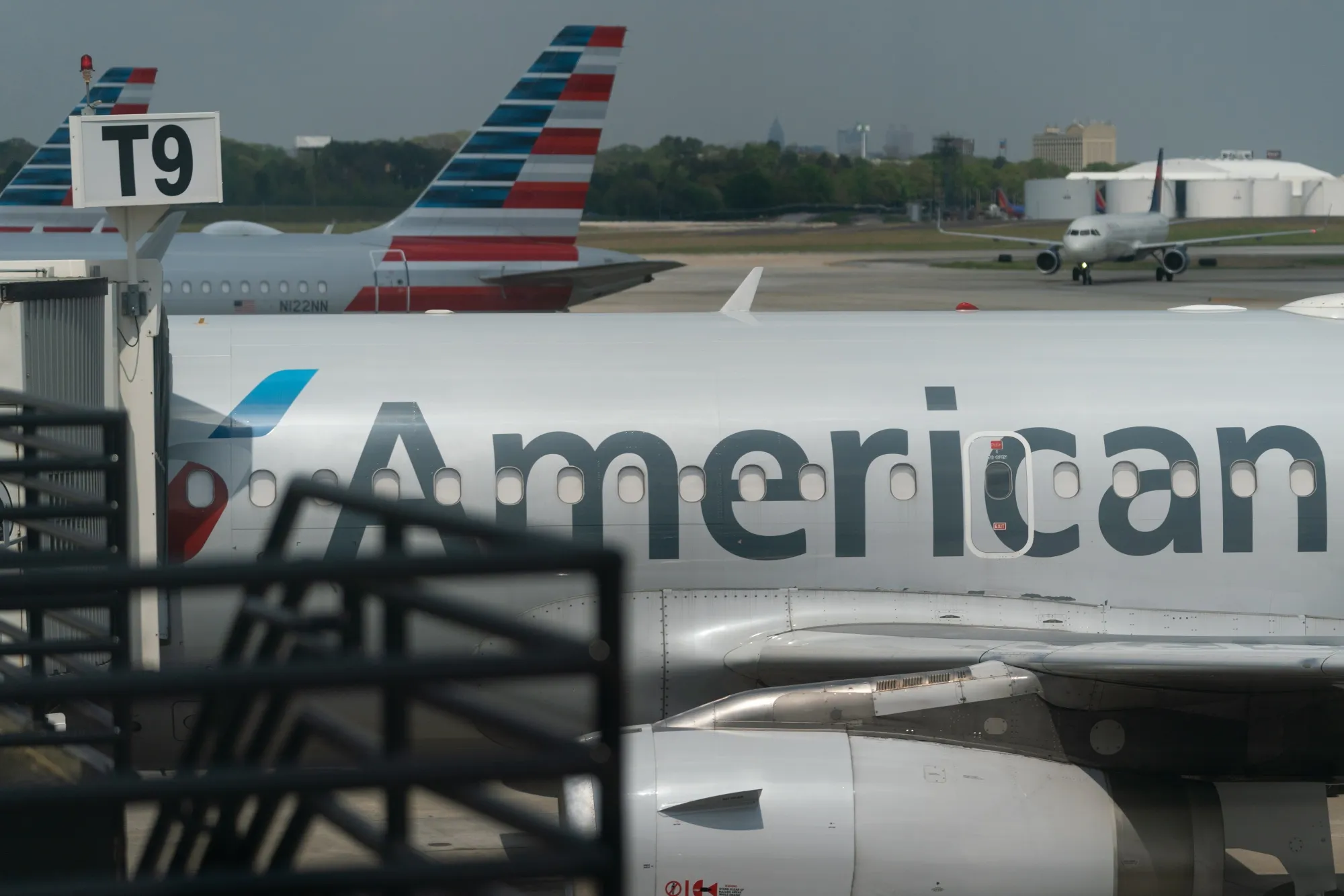 American Airlines Group Inc. planes parked at gates at Hartsfield-Jackson Atlanta International Airport in Atlanta, Georgia.