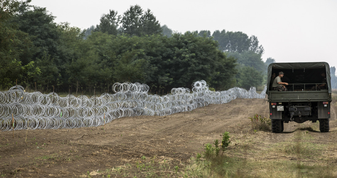 Members of the Hungarian Defence Force install barbed wire on the Hungarian-Serbian border to prevent illegal migrants from entering the country near Kelebia village in Hungary.
