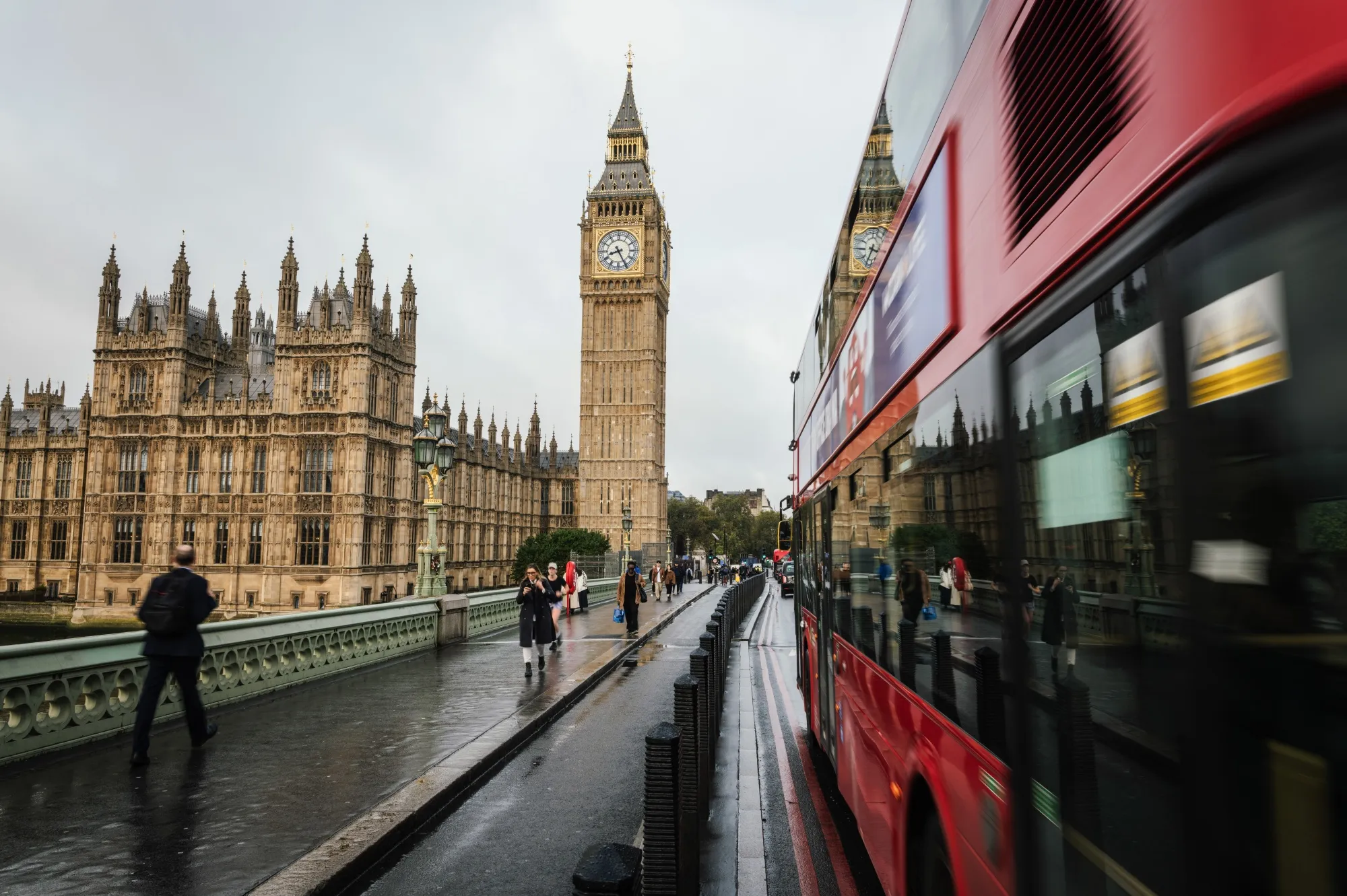 Commuters cross Westminster Bridge in London.&nbsp;
