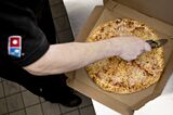 Operations At A Domino's Pizza Inc. Location As Earnings Are Released 