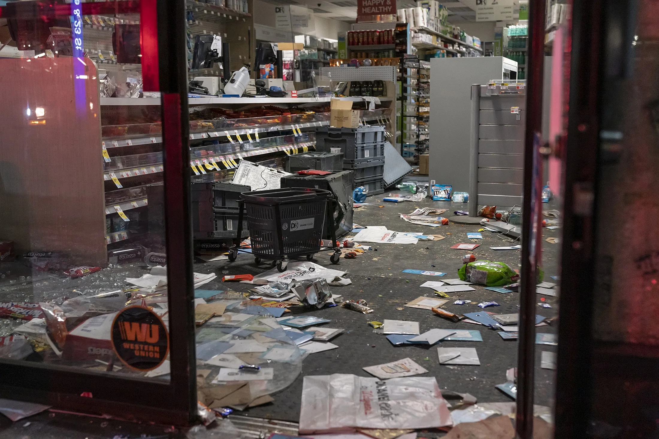 A looted pharmacy stands after protests in New York, on June 1.&nbsp;