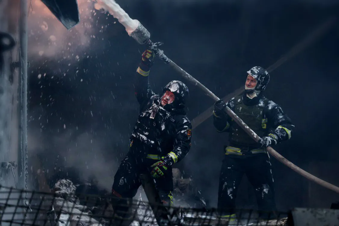 Emergency services at the site of a Russian attack in Ukraine, in a photo released on Dec. 25.