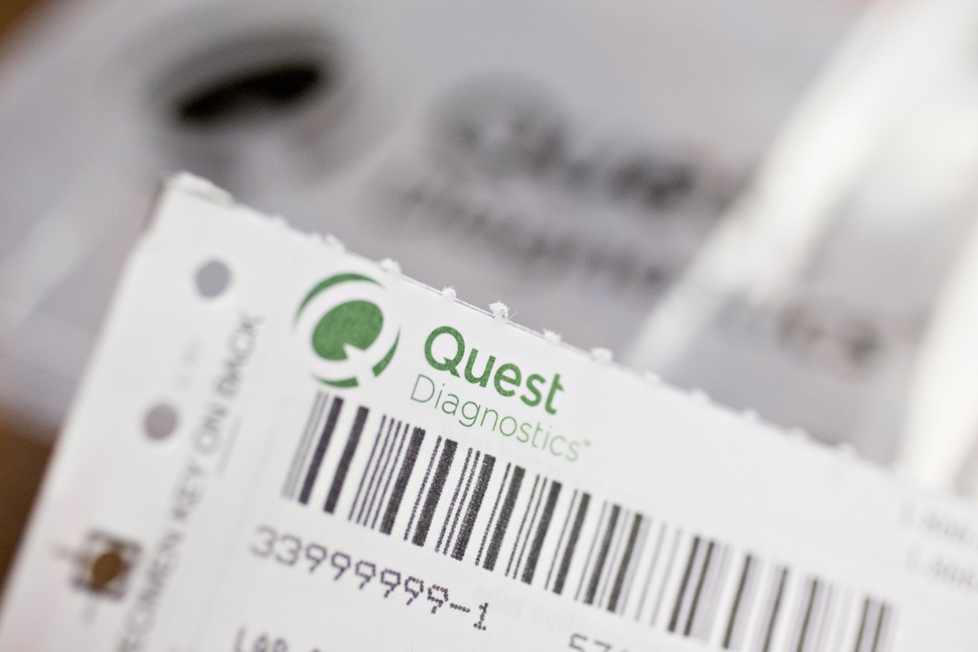 A Quest Diagnostics Inc. requisition form is displayed for a photograph.