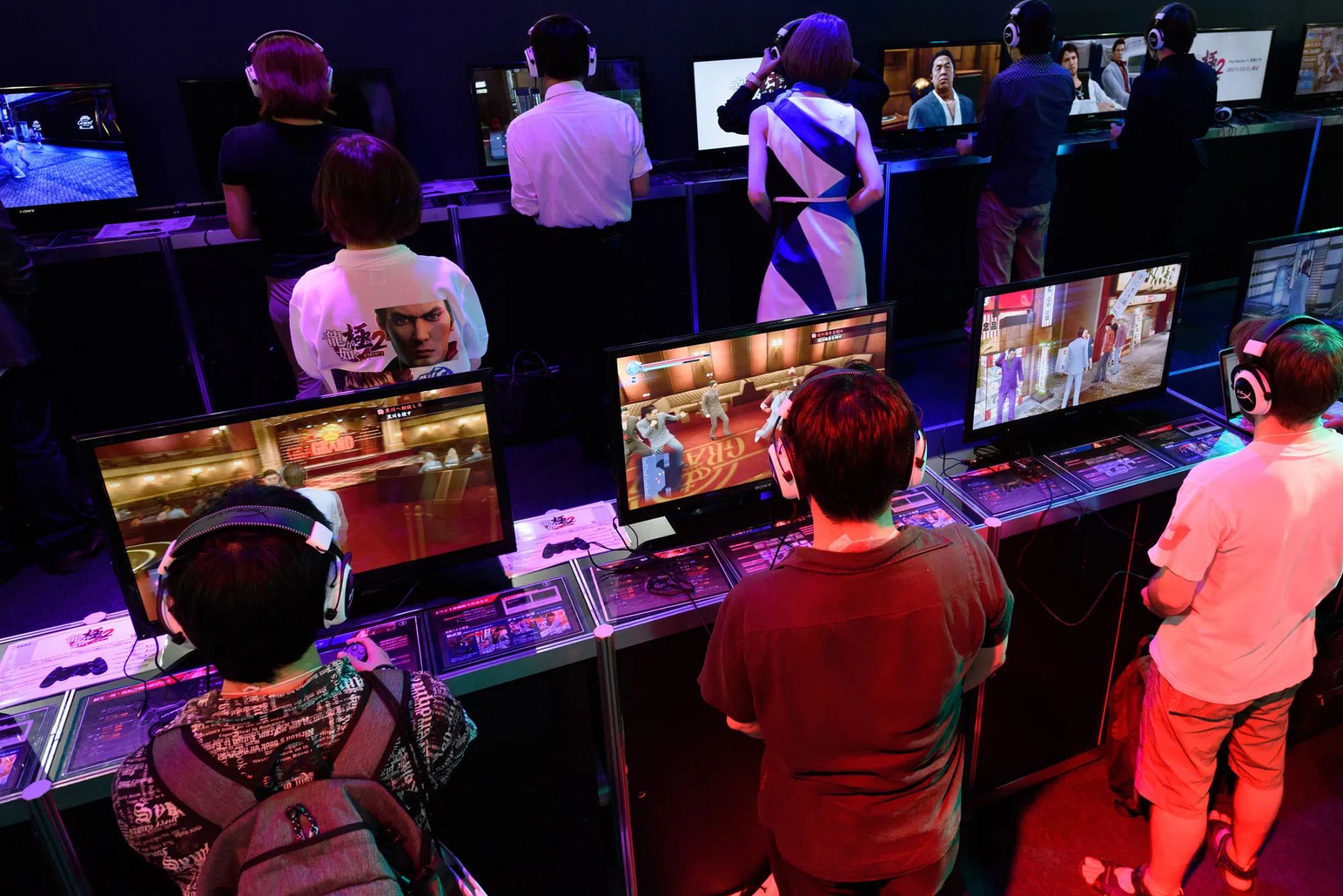 Attendees play video games on the PlayStation 4 at the Tokyo Game Show 2017 in Chiba, Japan, on Sept. 22, 2017.
