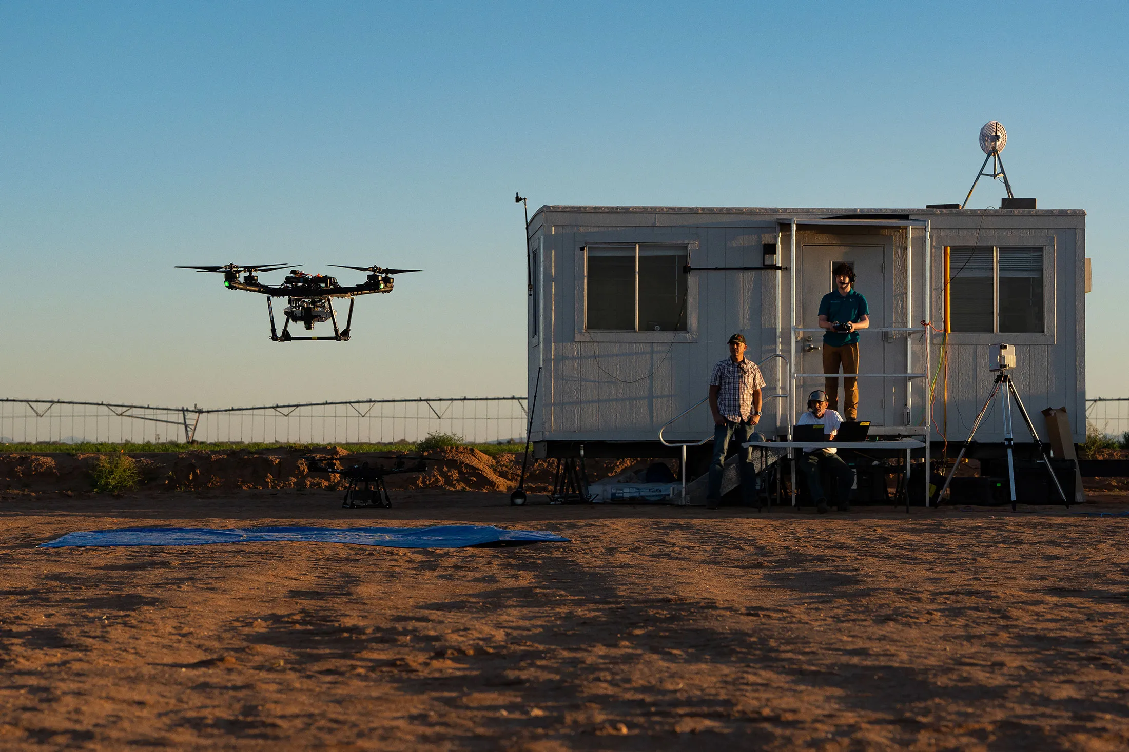 Precision AI crew members conduct a drone test flight in Maricopa, Arizona. The early-stage startup is one of 12 selected by analysts at BloombergNEF with potential to transform the decarbonized future.