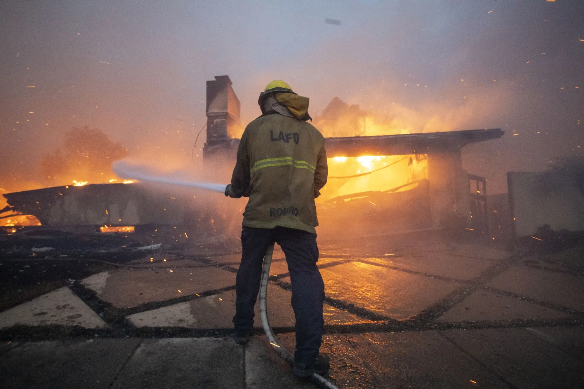 Fires fanned by hurricane-force wind gusts may spread flames deeper into these neighborhoods destroying more homes.