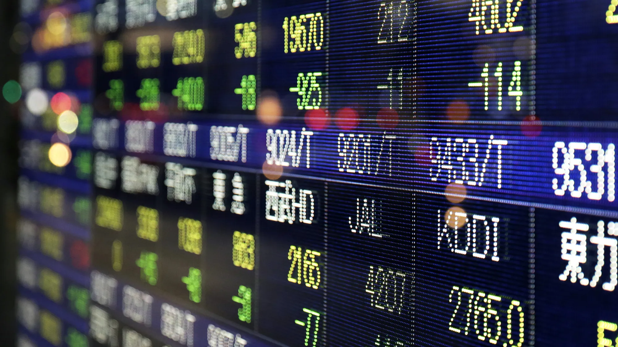 Stock indexes are displayed on an electronic stock board outside a securities firm in Tokyo, Japan, on Wednesday, Jan. 20, 2016. Japanese stocks plunged into a bear market amid a slump in equities across Asia as investor concerns over the global economic outlook outweighed technical signs that a China-fueled rout has gone too far.
