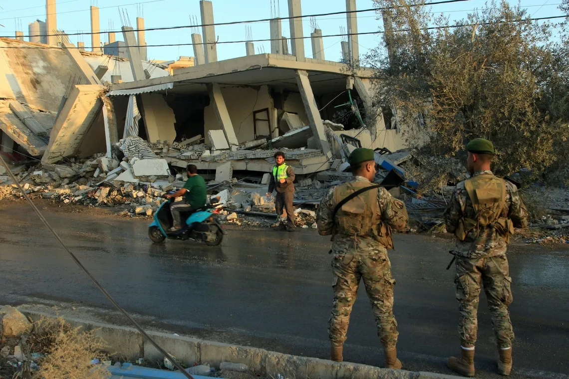Lebanese army soldiers secure the site of an Israeli airstrike in the southern Lebanese village of Deir Kifa on Nov. 19.