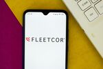 In this photo illustration the FleetCor Technologies logo