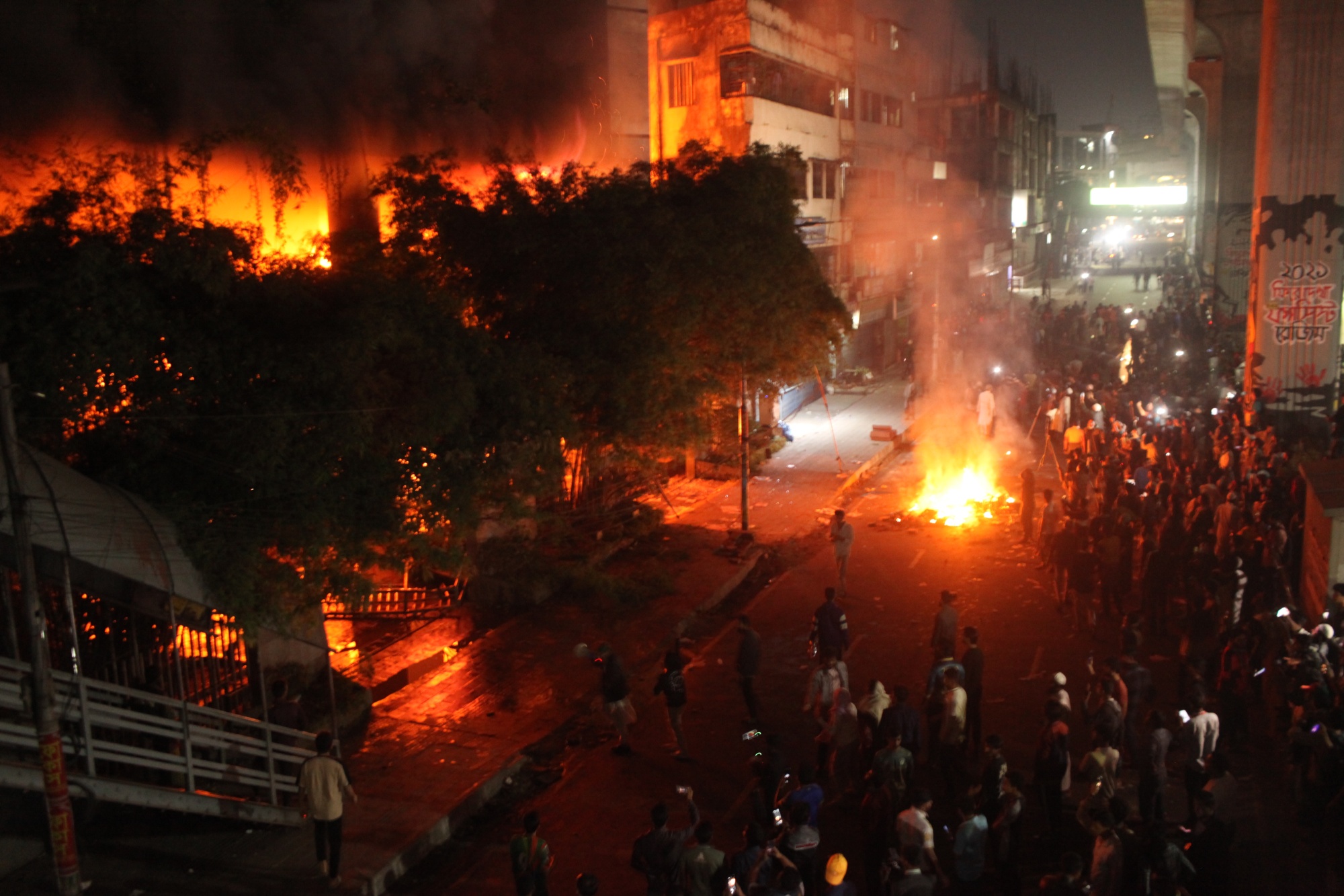 Protesters set fires at the offices of Bangladesh's leading daily newspapers The Daily Star and Prothom Alo following the news of the death of Sharif Osman Hadi, in Dhaka on Dec. 19.