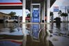 Floodwaters from Hurricane Harvey surround a fuel pump at an Exxon Mobil Corp. gas station in Houston, Texas, U.S.