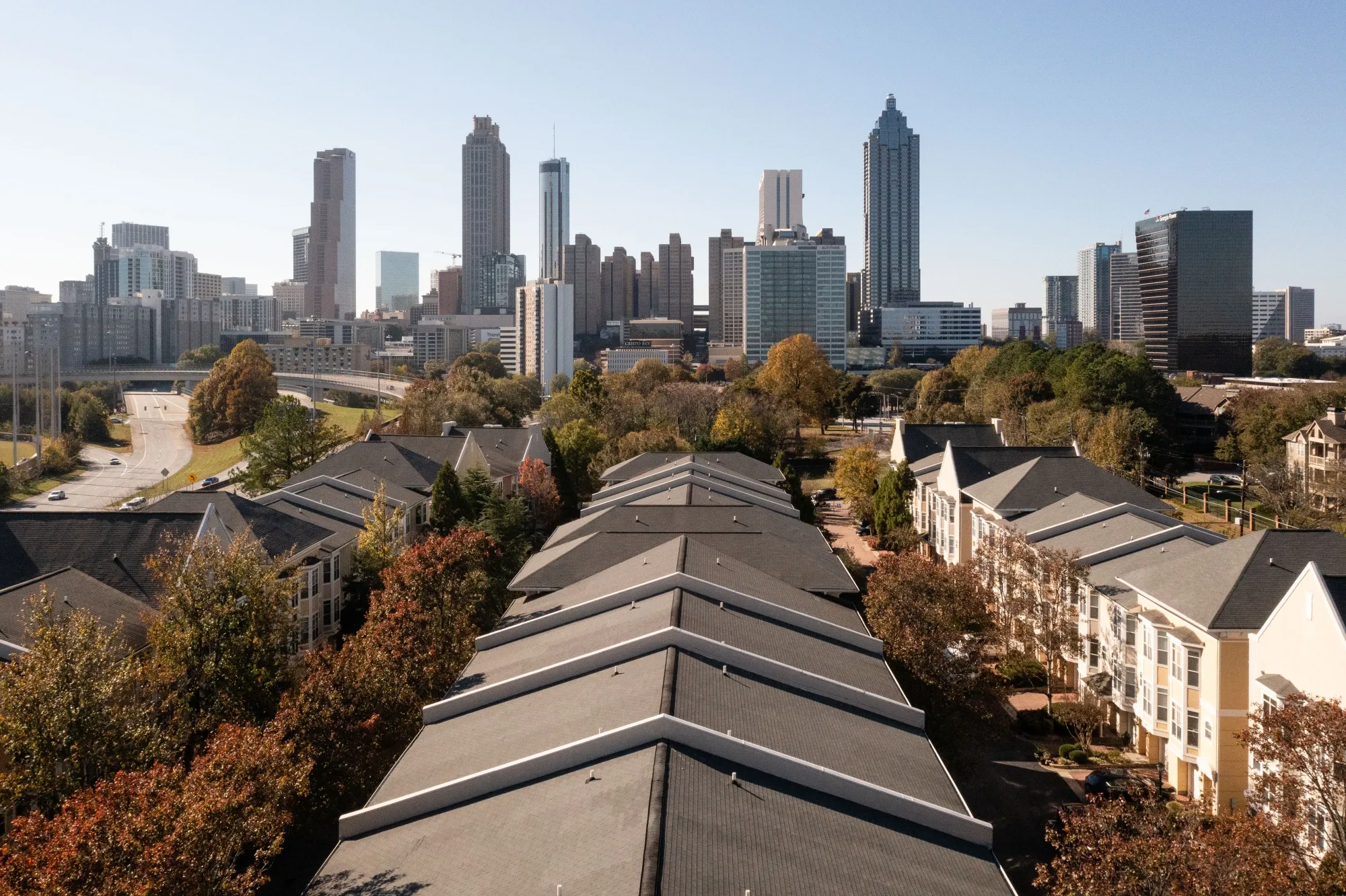 Housing in front of the Atlanta skyline.