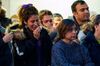 A woman weeps during a service at Western University in London, Ontario on January 8, 2020 for the four graduate students who were killed in a plane crash in Iran.