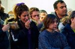 A woman weeps during a service at Western University in London, Ontario on January 8, 2020 for the four graduate students who were killed in a plane crash in Iran.