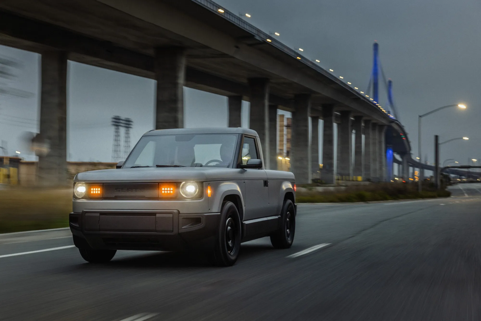 Its base model lacks creature comforts like power windows and the battery has a maximum range of about 240 miles.