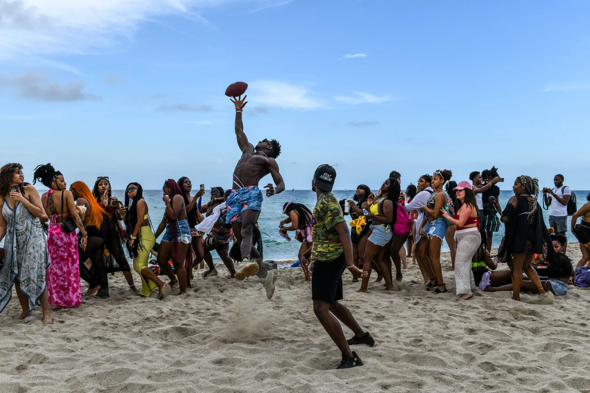 Revelers play beach football on the sand in Miami Beach in 2022.&nbsp;