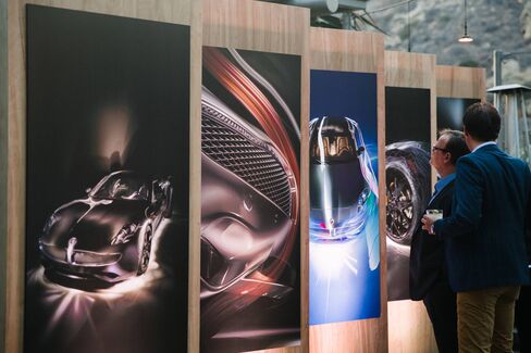 Guests peruse artistic mock-ups of the Karma Revero during the Laguna Beach unveiling.