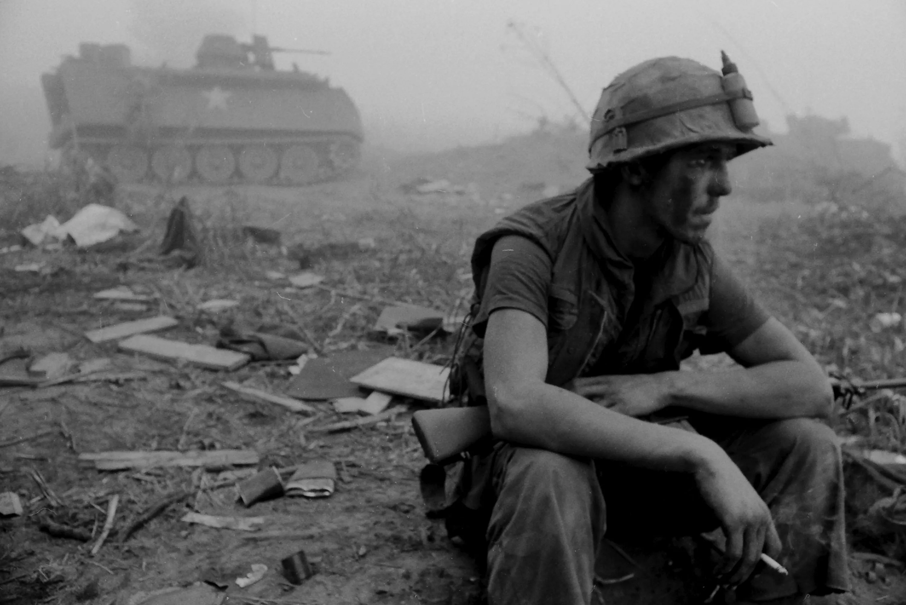 A&nbsp;US Army soldier&nbsp;sits beside an APC&nbsp;in the fog along Route Nine, 1971.&nbsp;