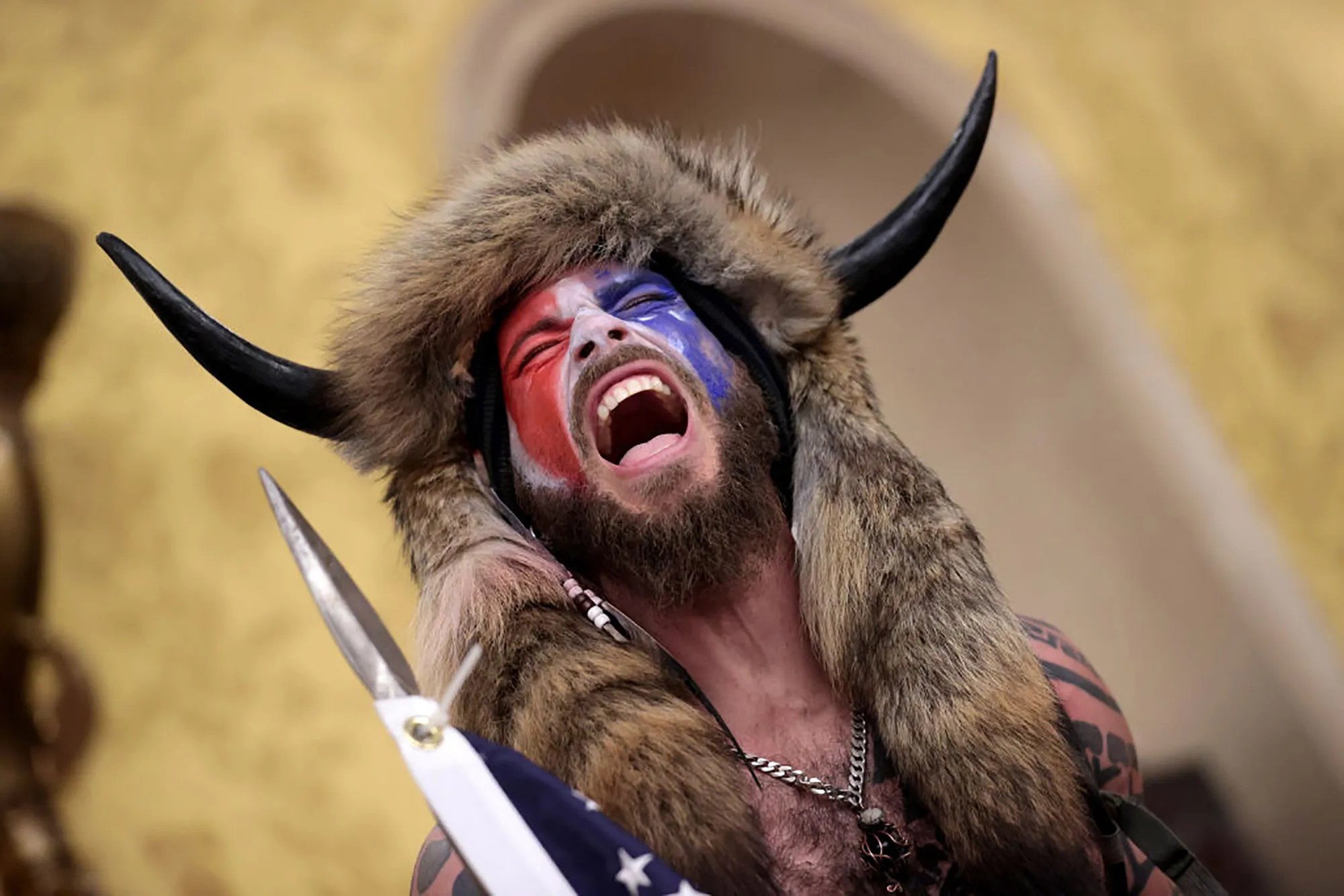 A protester screams "Freedom" inside the Senate chamber after the U.S. Capitol was breached.&nbsp;