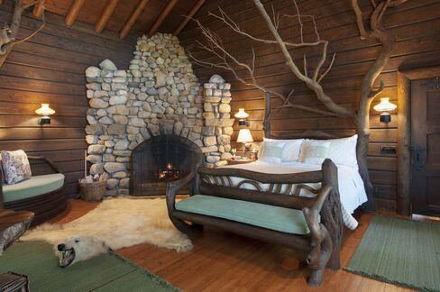 The "tree house" bedroom features a bed made from a tree.