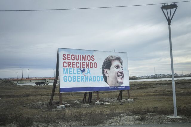 A political sign for Governor Gustavo Melella that reads in Spanish 'We Continue To Grow" along a road in Rio Grande.