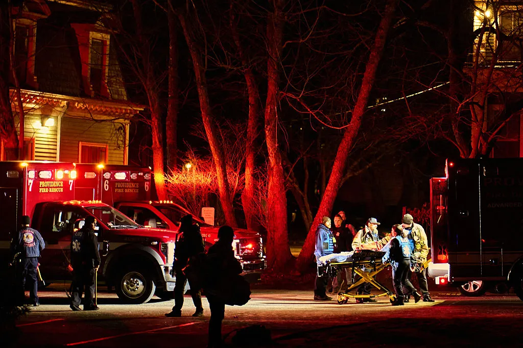 First responders maneuver an empty stretcher near the Barus & Holley building at Brown University campus in Providence, Rhode Island, on Dec. 13. 