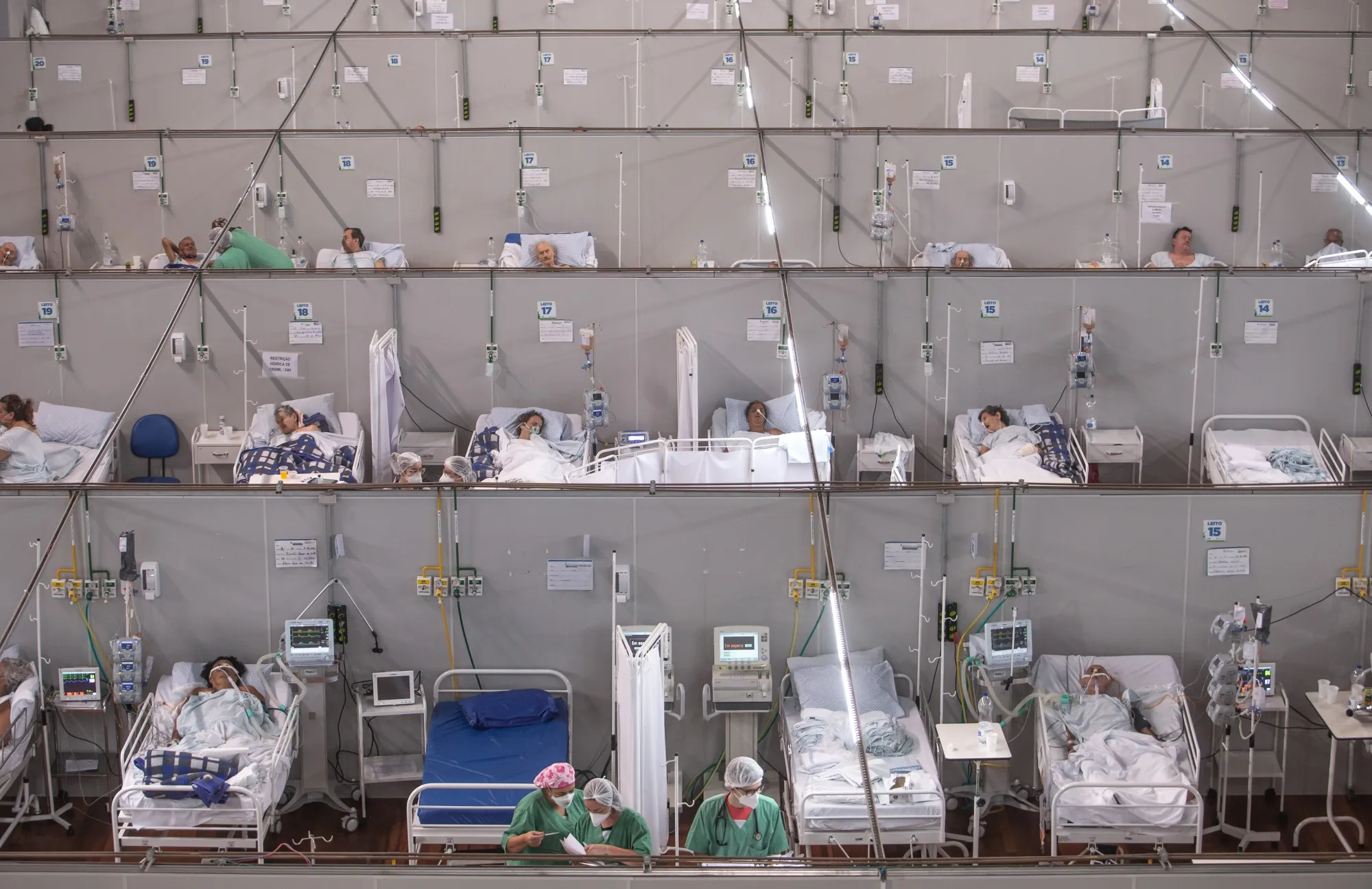 Healthcare workers inside a field hospital for Covid-19 infected patients at the Pedro Dell'Antonia sports complex in Santo Andre, Brazil, on&nbsp;Feb. 22.
