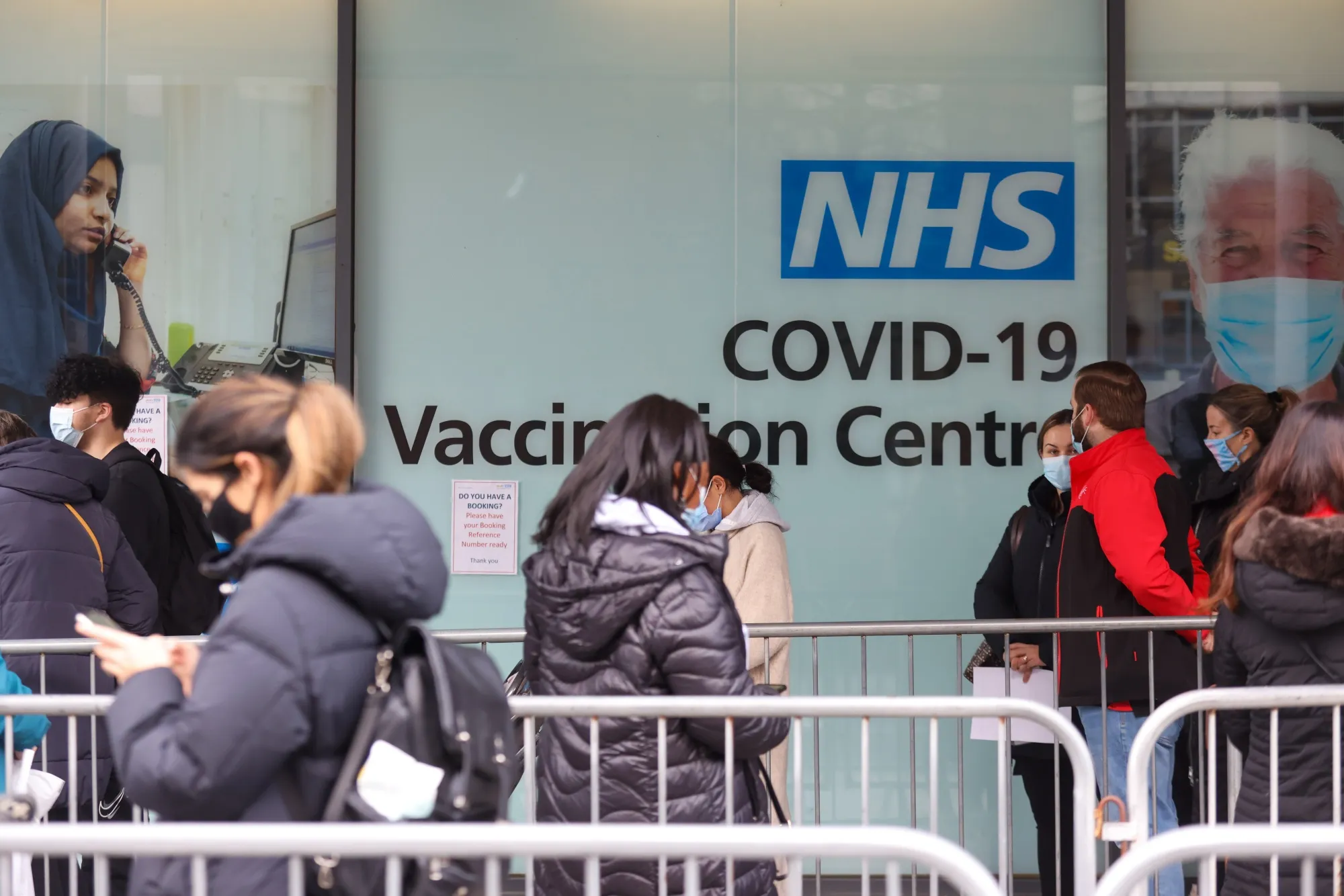 Visitors queue for Covid-19 vaccinations at a National Health Service walk-in vaccine center at Romford, U.K.