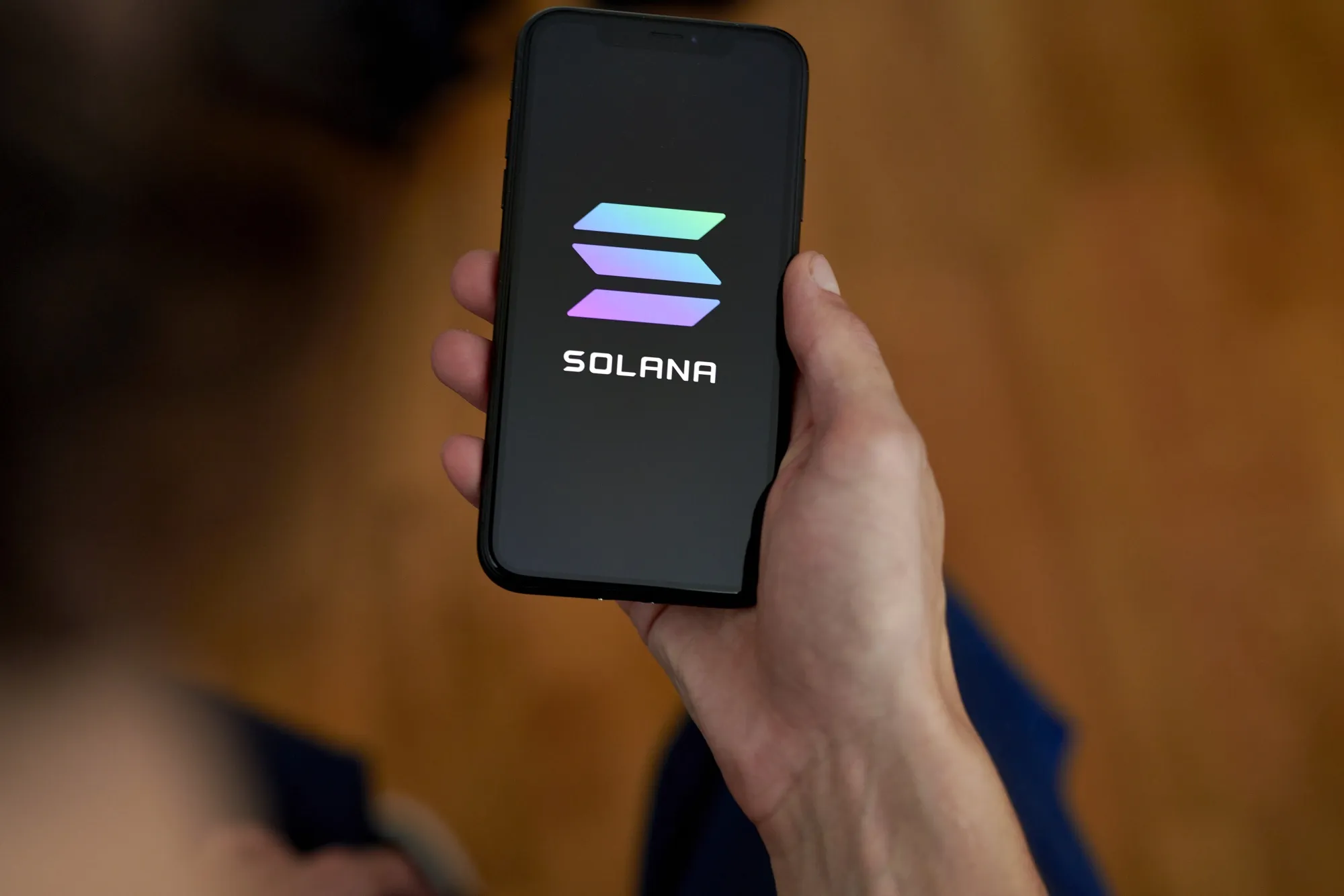 The Solana logo on a smartphone.