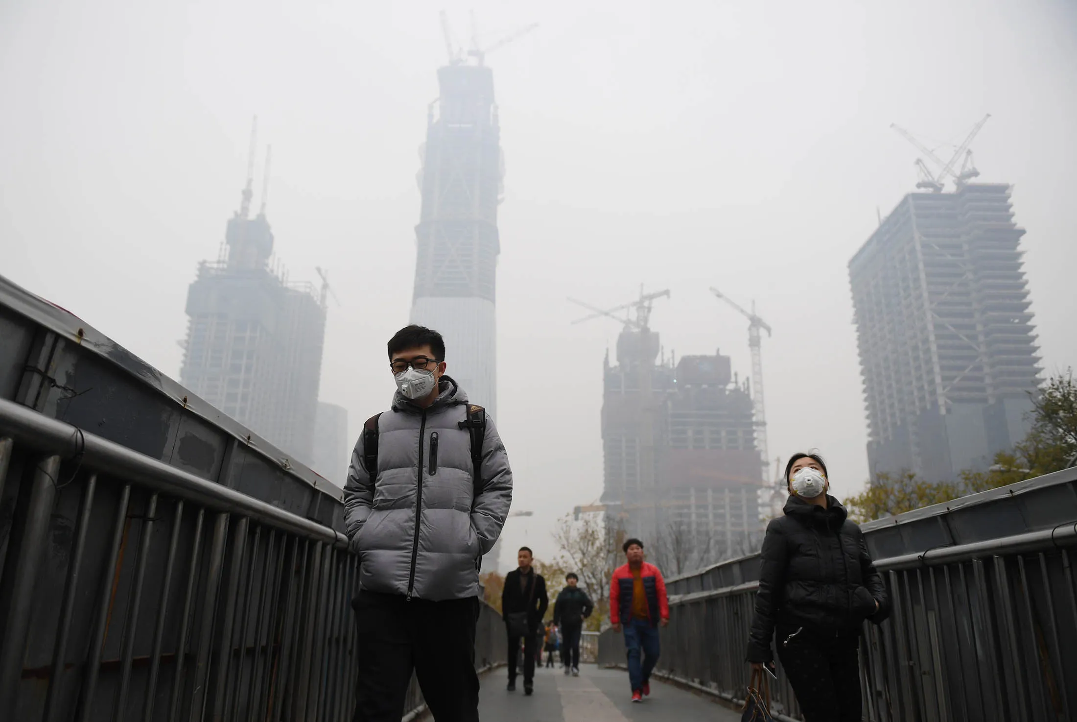 People wear masks on a polluted day in Beijing on Nov. 18.
