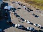 Vehicles wait in line to enter a Covid-19 vaccination drive-thru site in Greenville, Mississippi, on Jan. 15. 