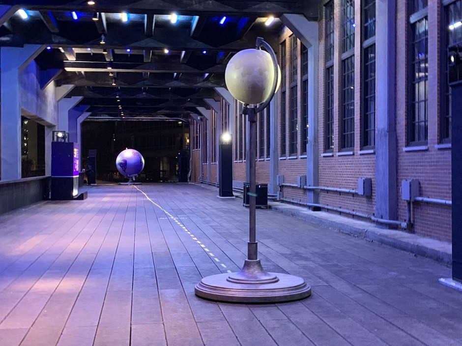 Conceptualized to spark dialogue on the significance—or lack of significance—of man-made borders, replicas of the earth, and moon made of steel, foam, and coated in acrylic, will transform the Chelsea Market Passage of the High Line between 15th and 16th street into a micro-solar system.