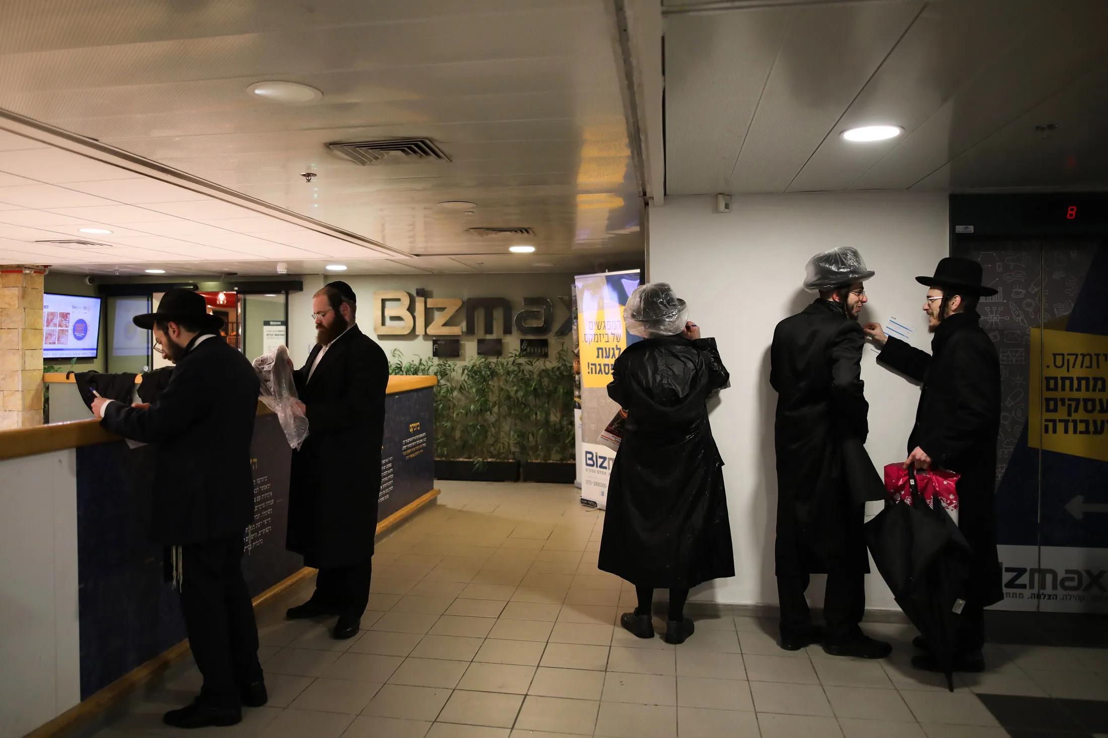 Ultra-Orthodox Jewish men fill out registration sheets at the Kivun Center, an employment center for the ultra-Orthodox population in Jerusalem,&nbsp;on Feb.&nbsp;28.
