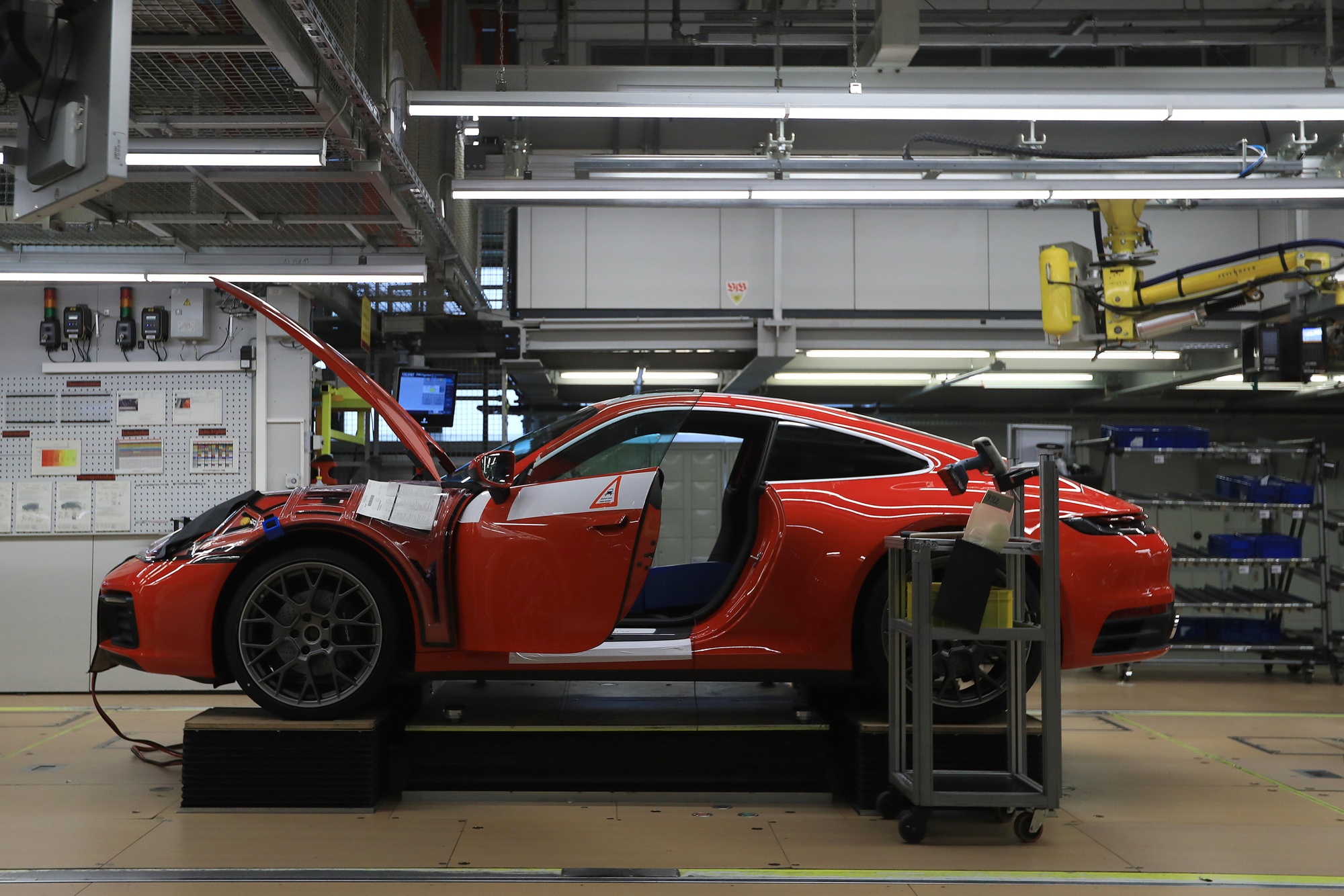 A red Porsche 911 on the production line a factory in Stuttgart, Germany.