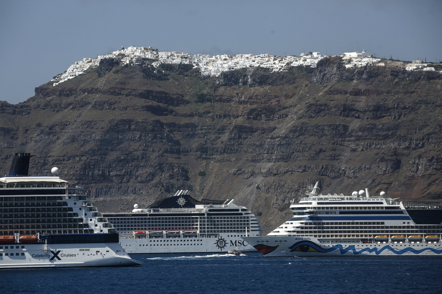 Cruise ships near the Aegean island of Santorini, Greece.