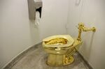 The gold toilet titled 'America'.