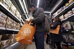 A customer shops at Amazon Go in downtown Seattle.