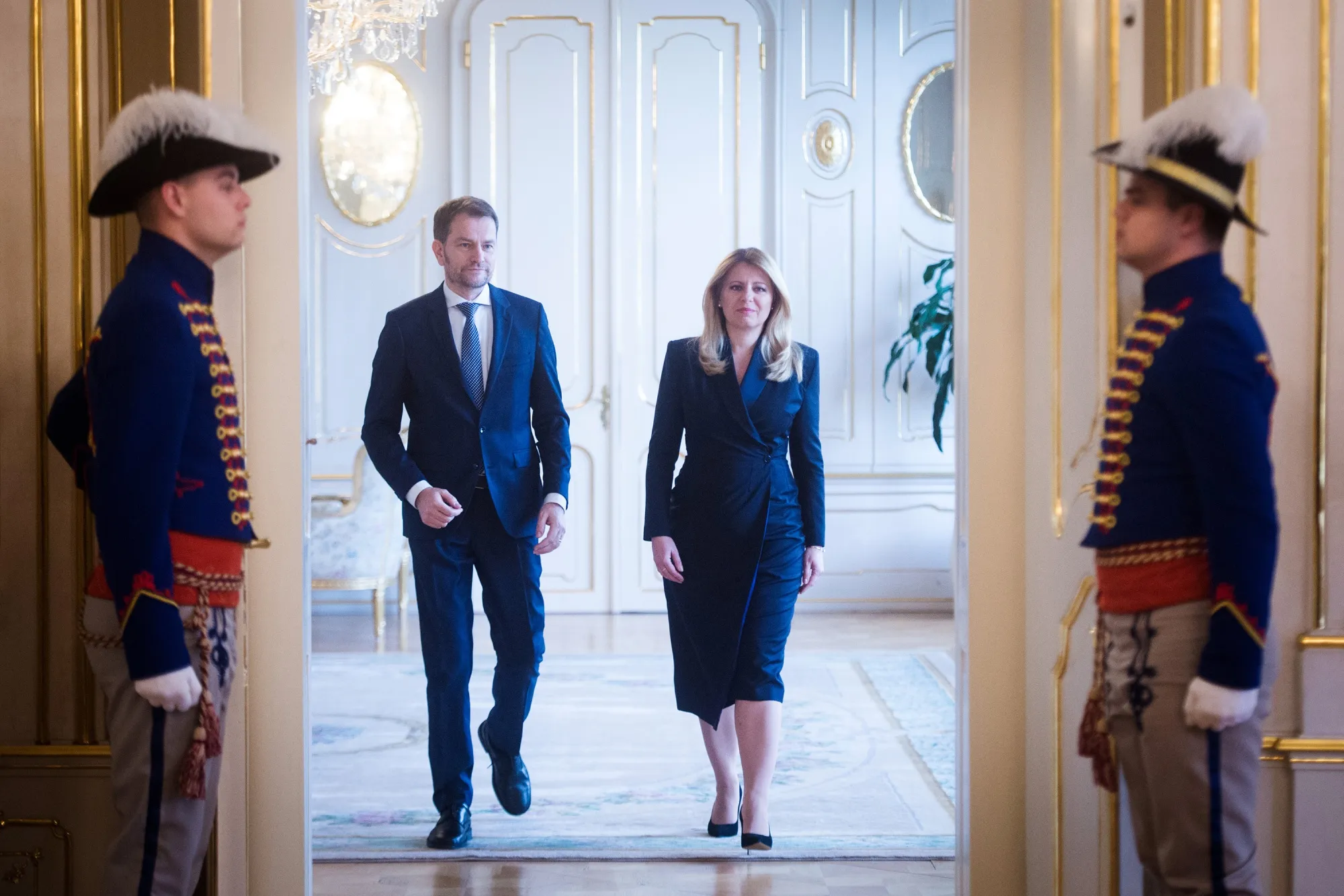 Igor Matovic, left, and Zuzana Caputova, arrive at the Presidential palace in Bratislava.